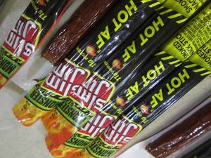 lot 191 image: 12 Slim Jim Hot AF Smoked Snack Sti...
