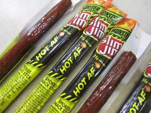 lot 196 image: 12 Slim Jim Hot AF Smoked Snack Sti...