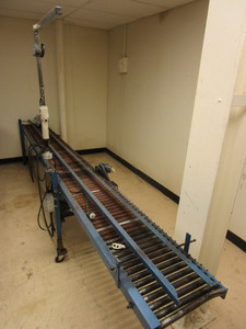 SURE-KAP HAND CAPPER, WITH ELECTRIC ROLLER CONVEYOR