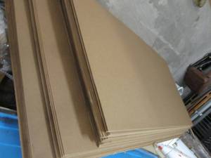 lot 104 image: Large Stack 4x8 ft Sheets of Cardbo...