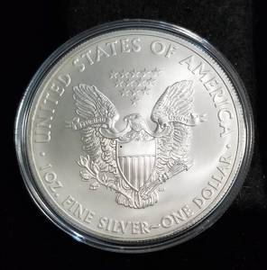 lot 64 image: 2012 AMERICAN SILVER EAGLE 1 TROY OZ. .999 FINE SILVER IN AIRTITE