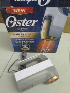 lot 43 image: oster hand mixer with heatsoft tech...