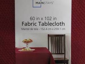 lot 74 image: A box full of table cloths differen...