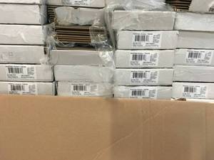 LOT WITH 24 CASES OF HOME DECORATORS COLLECTION Stanhope Hickory 8 mm Thick x 7-23 in. Wide x 50-58 in. Length Laminate Flooring (21.48 sq. ft.  case)