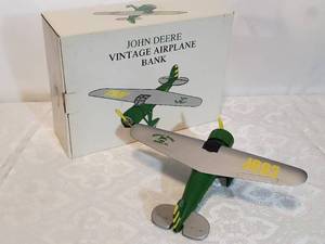 lot 28 image: John Deere Metal Replica 1927 Lockheed Vega 5B Bank