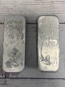 lot 56 image: Lot of 2 Hand Poured 10oz Aluminum Bars