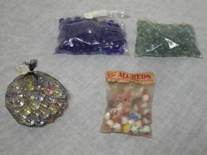 lot 16 image: 4-Bags Of Marbles