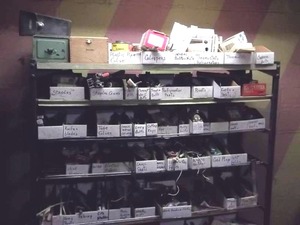 lot 42 image: Organizer Shelf With Contents.- Bring Boxes for Removal