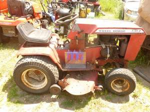 Wheelhorse model C-125 lawn mower. Kohler motor. Consignor states it does run but will need some wiring repair. As shown.