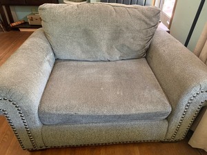 lot 5 image: Extra Wide Gray Upholstered Chair and Matching Ottoman