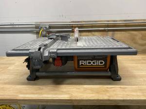 lot 28 image: RIGID 6.5 Amp Corded 7 in. Table Top Wet Tile Saw