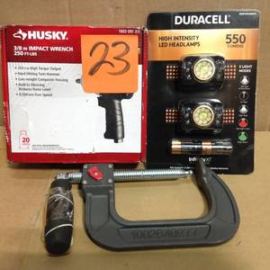 lot 23 image: Husky 250 ft.lbs. 38 In. Impact Wrench PLUS 2 PACK LED HEADLAMPS in good condition