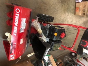 Troy-Bilt 24 in. 208 cc Two-Stage Gas Snow Blower with Electric Start Self Propelled missing chute clamps used in like new working conditions