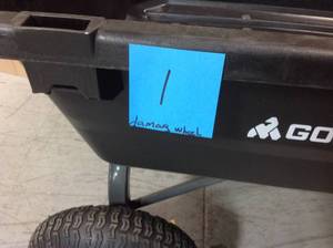 lot 1 image: GORILLA CARTS  7 cu. ft. Poly Yard Dump Cart  WHEEL Have some damage on the axel  small bent 