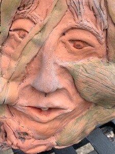 lot 71 image: Terracota Face Art by Maureen Fisher
