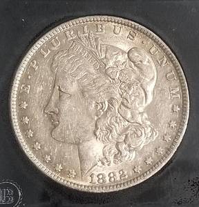 1882 OS MORGAN SILVER DOLLAR IN BLACK SLAB