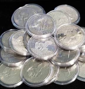 GROUP OF 22 CLAD EISENHOWER DOLLARS IN AIRTITES