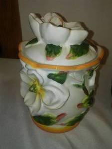 lot 19 image: Ceramic floral kitchen canisters.