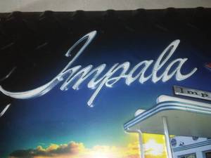 lot 36 image: Chevy Impala Sign- New