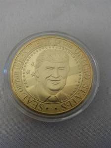 lot 23C image: Donald Trump Gold Plated Coin silver dollar size.