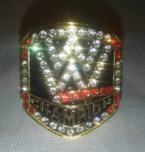 lot 101E image: WWE or WWF World Wrestling Gold Colored Ring Champion size 11.