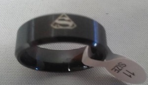 lot 151 image: Superman Emblem ring - black colored, size 11