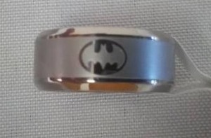 lot 153 image: Batman Emblem ring - silver colored Size 6.