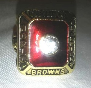 lot 154 image: Cleveland Browns World Champions 1955 gold colored 10.5-11 NFL.
