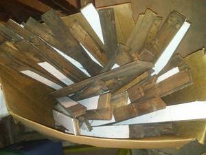 lot 158 image: 5 Boxes of 2 inch flooring - hardwood. Most is about 2 foot in length. Nails & painted. Was a coal room at one point. Tongue and Groove Great for mosaic floor or  projects