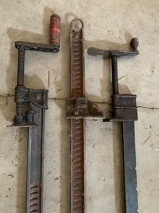 lot 131 image: Three Long Metal Clamps