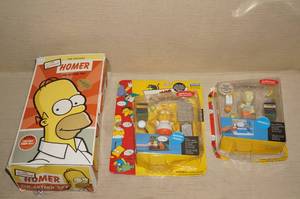 lot 80 image: Homer Simpson Tin Toy, and Playmates Toys