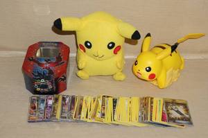 lot 93 image: 2 Pokemon Pikachu Toys and Tin of Cards