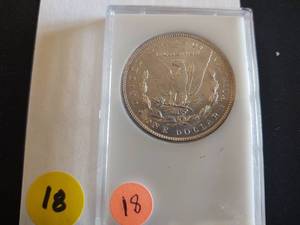 1890 BU Morgan in Capital Holder marked MS 65 when purchased