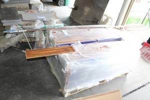 lot 79 image: Lot of (30) Boxes of Pryzm Waterproof Luxury Wood Flooring, FlorstarBrauns End Cap Trim