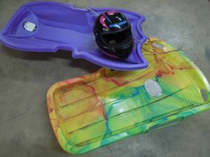 lot 58 image: 2 Sleds and Small Polaris Helmet