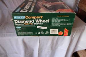 lot 65 image: New Plasplugs Diamond Wheel Wet Saw