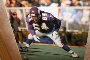 lot 142 image: Framed Photo Vikings Randall McDaniel #64