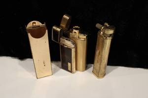lot 27 image: Vintage Brass Lighters and Case