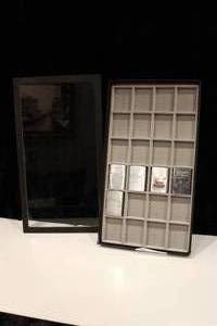 lot 29 image: Five Zippo Lighters & Display Case