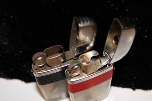 lot 35 image: 2 Vintage Scripto Clear Fishing Lure Lighters