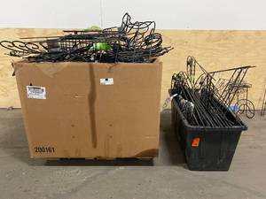 Pallet of various yard related items.  Plant hangers, plant baskets, garden hose holders.