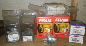 lot 17 image: NEW Oil Filters, Solenoid, wheel kits