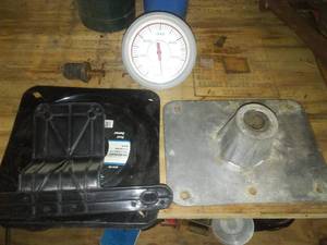 lot 26 image: Boat seat mounts, tachometer.