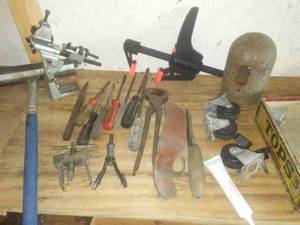 lot 33 image: Filet knife, pullers, clamp & more.