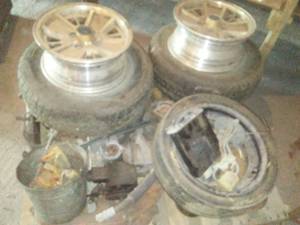 lot 186 image: Pallet of Nissan 280Z parts. 4 Lug rims - aluminum & more.