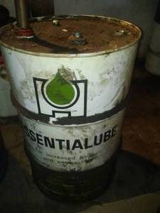lot 291 image: Essential Lube 15 gallons - additive. 30 gallon drum and pump.