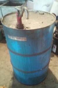lot 292 image: 55 gallon drum and  pump -.empty.