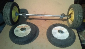 lot 305 image: 2 NEW Never Flat Tires, hard tires & axle.