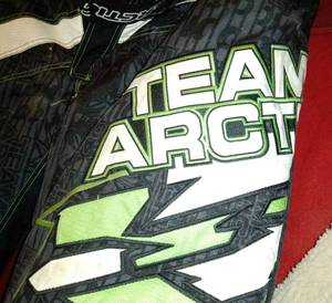 lot 516 image: Arctic Cat Vintage winter wear,  2XL Arctic Cat Snowmobile Pants and more