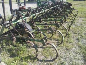 lot 129 image: John Deere cultivator 15 ft. width.